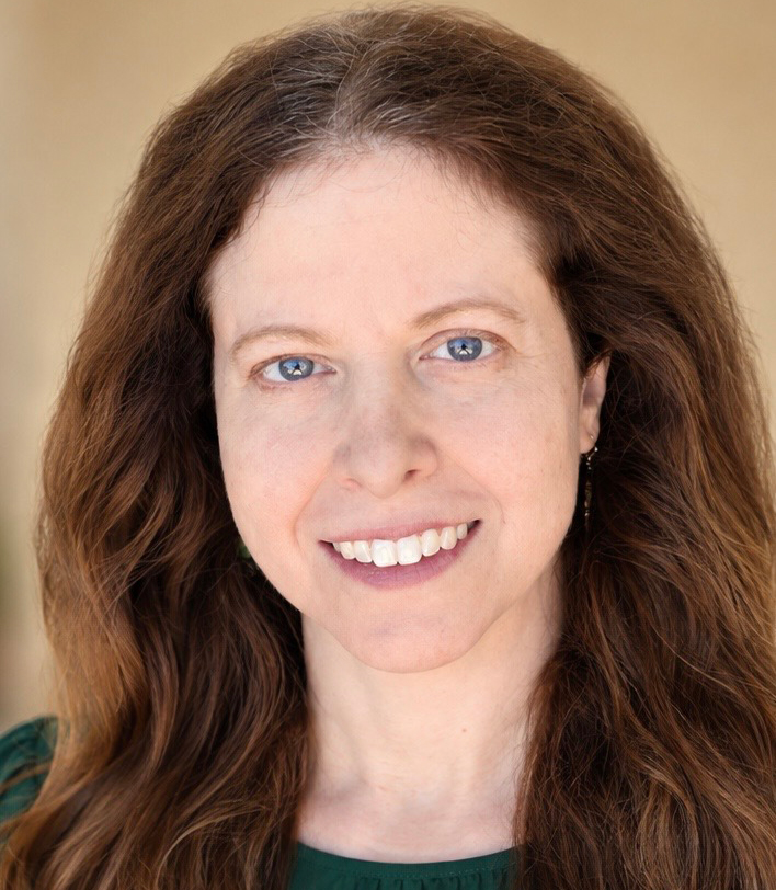 Leila Berg, PA-C, DMSc, MS, smiling in a green shirt